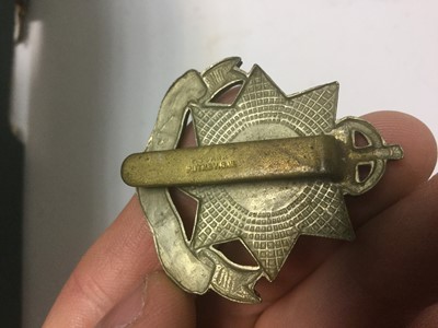 Lot 256 - Group of First World War and later military cap badges, two silver war badges and various military and other buttons