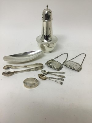 Lot 659 - Small group of silver to include a dish by A.E. Jones, silver sugar castor, pair of silver spirit labels, spoons and tongs.