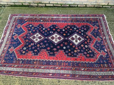 Lot 871 - An old Afshar rug on red and blue ground, 242cm x 170cm