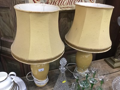 Lot 36 - Pair of yellow glazed oviform table lamps with silk shades