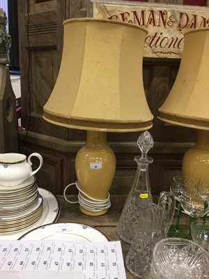 Lot 36 - Pair of yellow glazed oviform table lamps with silk shades