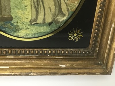 Lot 43 - Georgian oval silkwork panel - classical lady in landscape, in verre eglomise gilt frame
