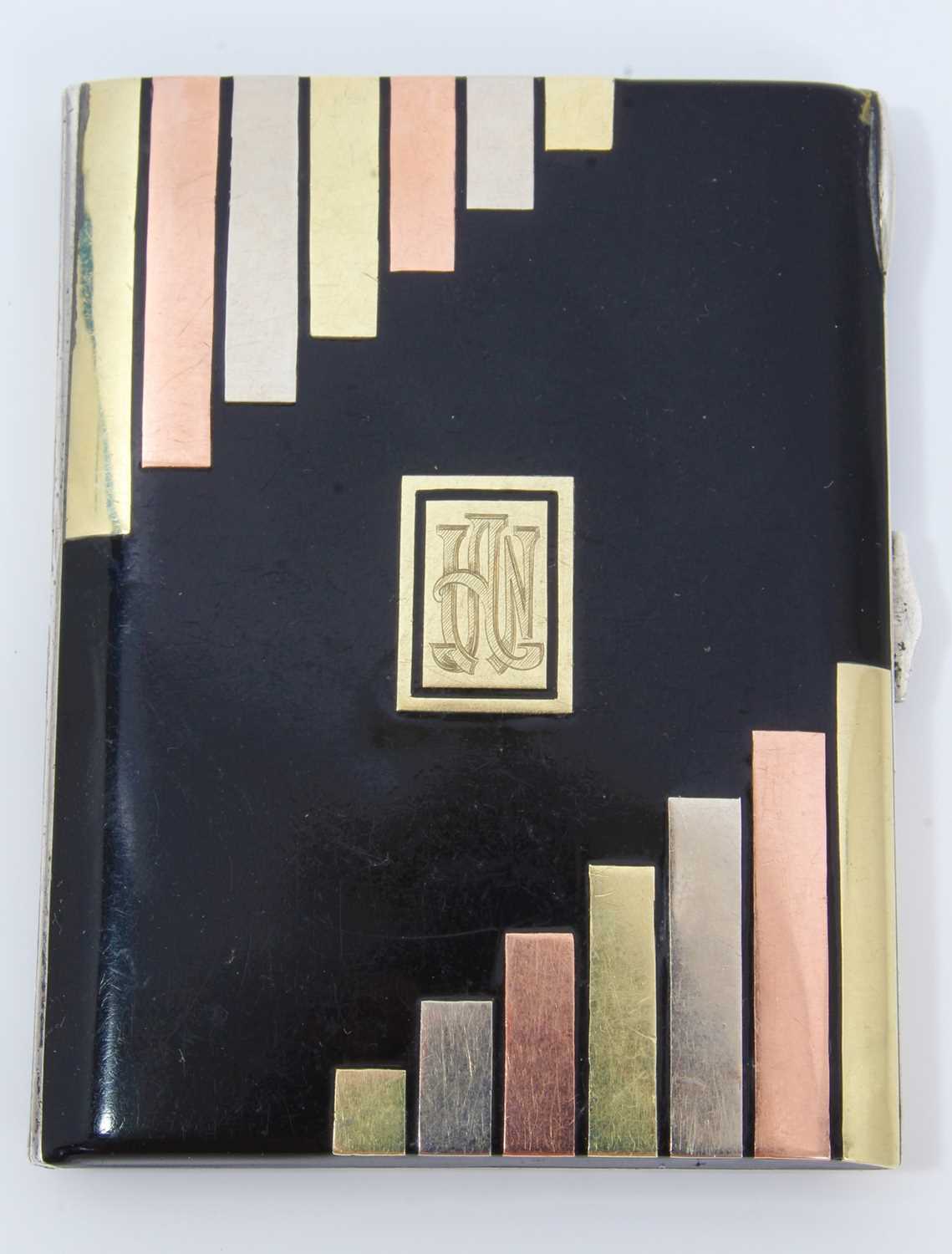 Lot 400 - Art Deco cigarette case, black enamelled with gold and silver inlaid decoration, in the manner of Cartier