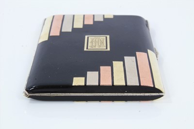 Lot 400 - Art Deco cigarette case, black enamelled with gold and silver inlaid decoration, in the manner of Cartier