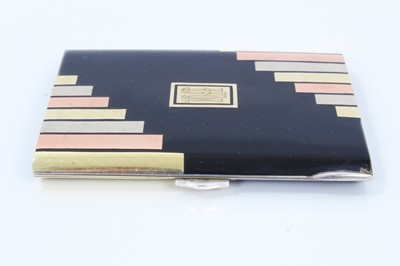 Lot 400 - Art Deco cigarette case, black enamelled with gold and silver inlaid decoration, in the manner of Cartier