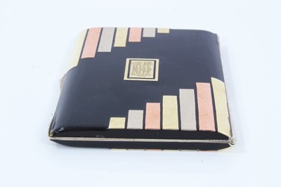 Lot 400 - Art Deco cigarette case, black enamelled with gold and silver inlaid decoration, in the manner of Cartier