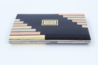 Lot 400 - Art Deco cigarette case, black enamelled with gold and silver inlaid decoration, in the manner of Cartier