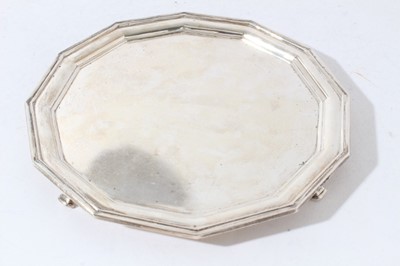Lot 76 - George V silver salver of octagonal form with reeded borders, raised on four feet, (Sheffield 1931), maker Atkin Brothers, 20.5cm in diameter