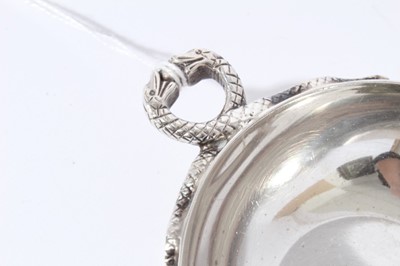 Lot 67 - Contemporary silver wine taster of circular form with intertwined Serpent handle, (London 1972), maker L.P., 2.5oz, 11cm in diameter