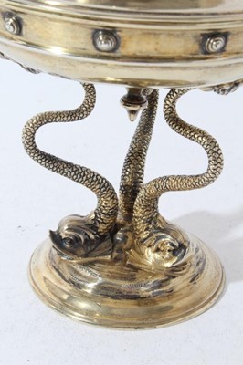 Lot 177 - Unusual Edwardian silver gilt cup and cover, the cup of circular form, on a circular base raised by three classical Dolphins and cover with finial depicting Triton, with presentation