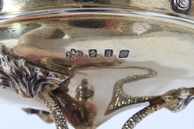 Lot 177 - Unusual Edwardian silver gilt cup and cover, the cup of circular form, on a circular base raised by three classical Dolphins and cover with finial depicting Triton, with presentation