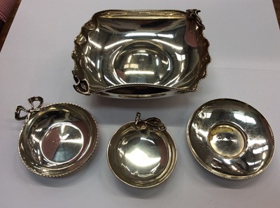 Lot 664 - Silver dish with lily decoartion, silver dish in the form of an apple, silver dish with bow decoration and one other silver pin dish