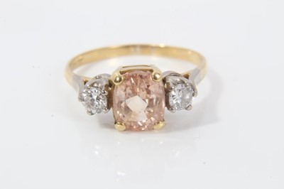 Lot 56 - Padparadacha sapphire and diamond three stone ring