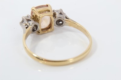 Lot 56 - Padparadacha sapphire and diamond three stone ring