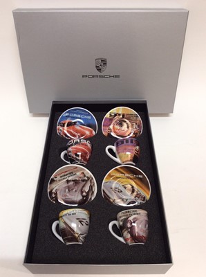 Lot 1218 - Official Porsche four person coffee set decorated with scenes of classic Porsche 911's, in branded box