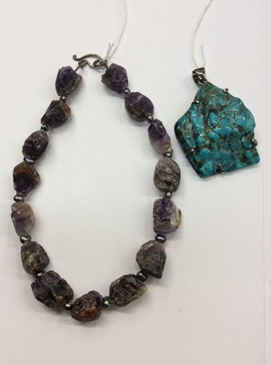 Lot 671 - Large turquoise silver mounted pendant and an amethyst necklace