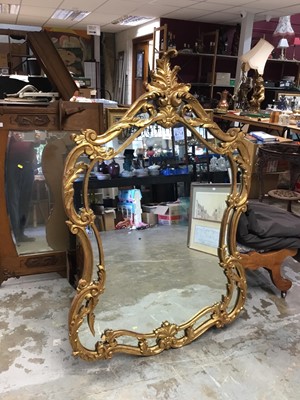 Lot 1082 - Ornate gilt framed over mantle mirror