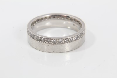 Lot 188 - Platinum wedding ring with a full band of 32 round brilliant cut diamonds weighing 0.64 carats in total