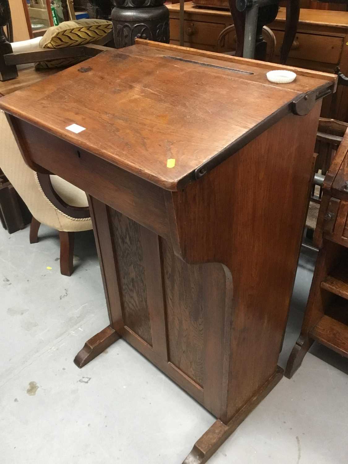 Lot 895 - Late Victorian oak school desk with cupboard