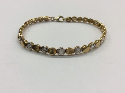 Lot 677 - 9ct white and yellow gold bracelet set with synthetic white stones