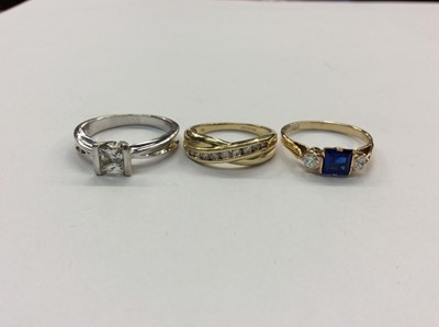 Lot 679 - 14ct white gold dress ring, 14ct gold cross over ring and 9ct gold three stone dress ring