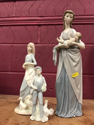 Lot 527 - Large Lladro figure of a mother cradling a baby, and two other similar figures