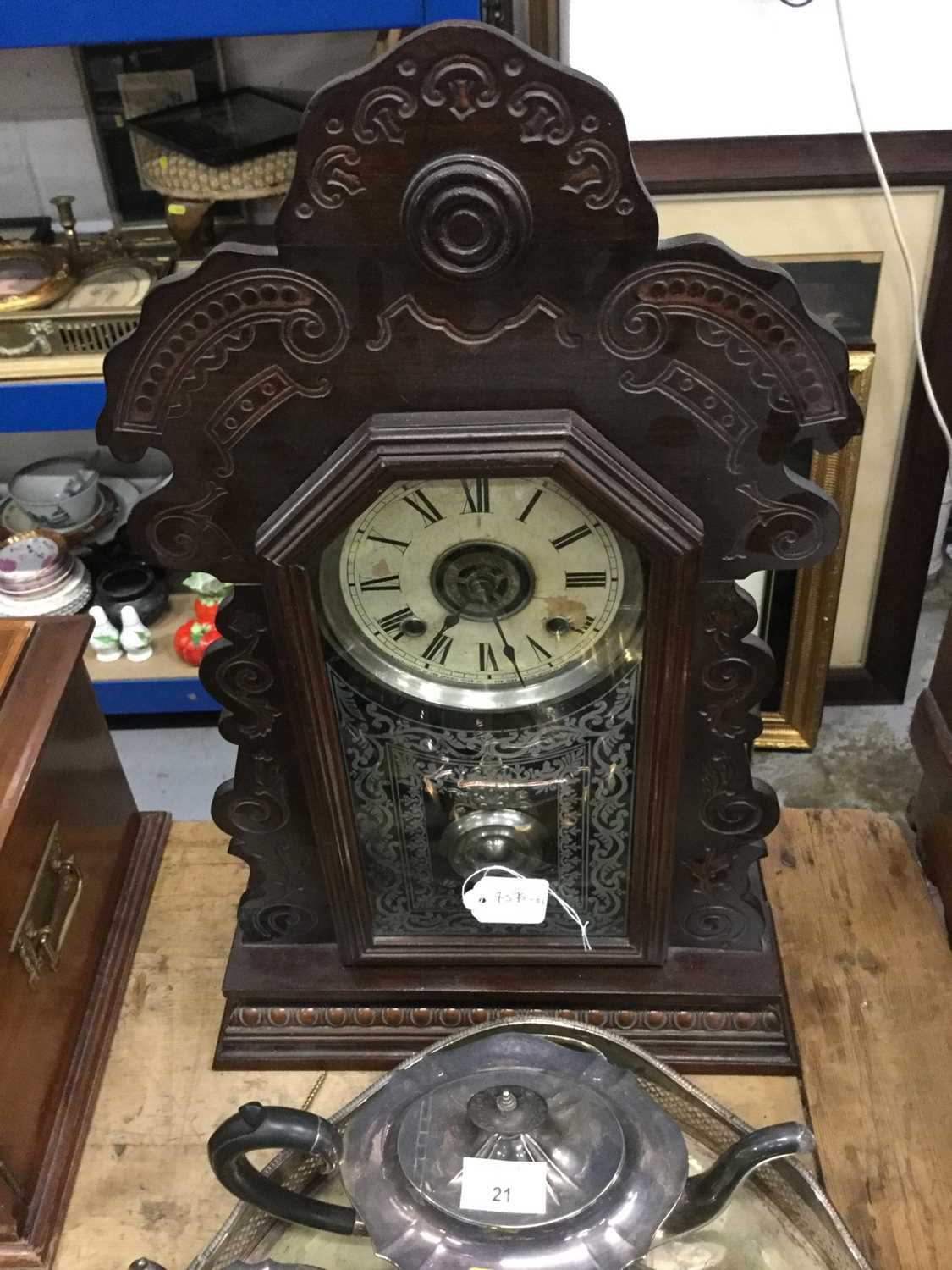 Lot 23 - American mantel clock in carved wood case