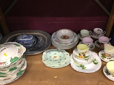 Lot 529 - Two shelves of ceramics, including early blue and white Willow pattern, Paragon 'Famous Roses' tea wares, Copeland Spode Italian, Coalport Indian Tree, etc