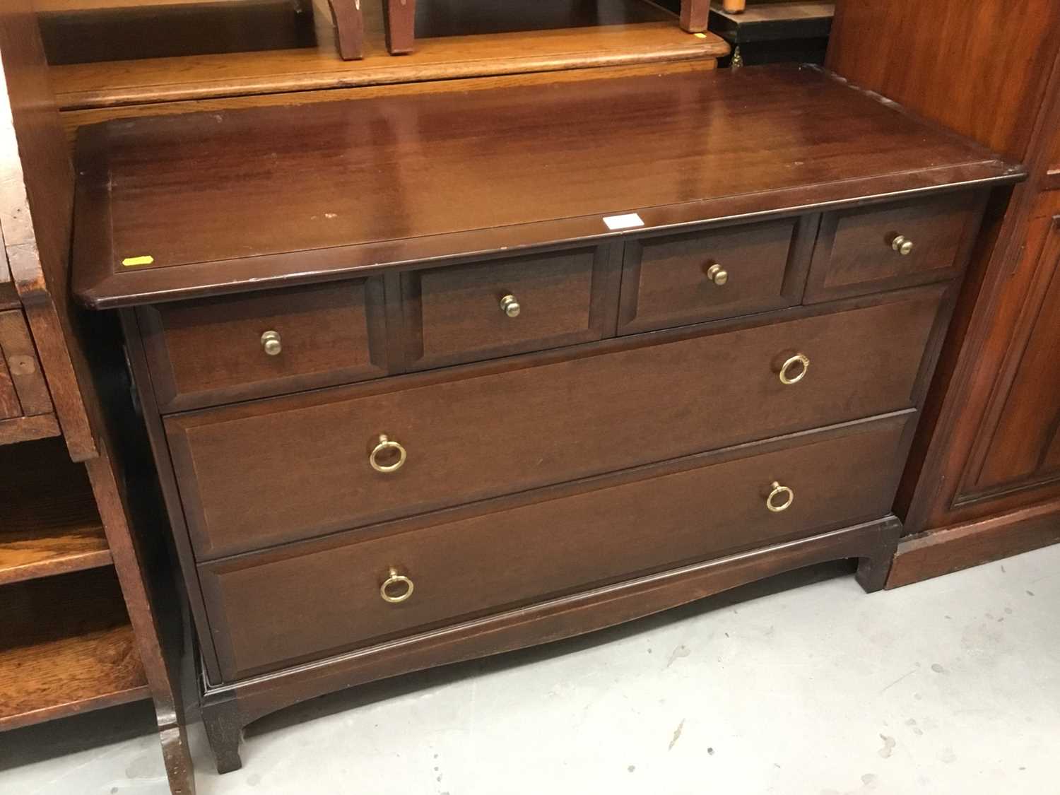 Lot 893 - Stag mahogany chest of six drawers on bracket feet 107 cm