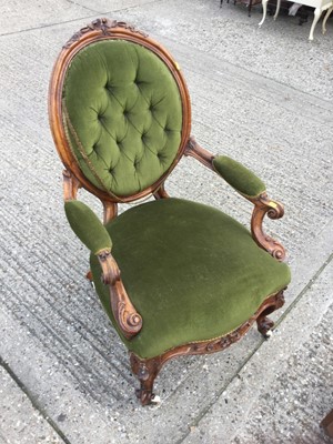 Lot 944 - Victorian Walnut framed arm chair with carved scroll arms and green velvet upholstery on cabriole legs, with ceramic casters