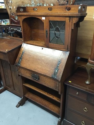 Lot 894 - Edwardian art Nouveau oak escritoire bookcase with leaded glazed cupboard, fall flap , drawer and two shelves below 148 cm wide, 87cm wide