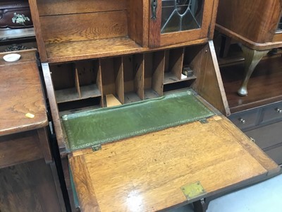 Lot 894 - Edwardian art Nouveau oak escritoire bookcase with leaded glazed cupboard, fall flap , drawer and two shelves below 148 cm wide, 87cm wide