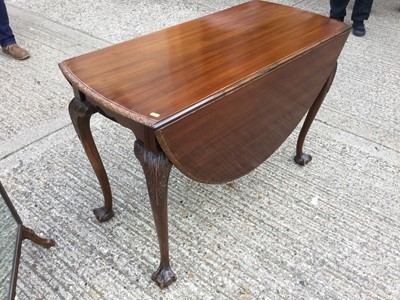 Lot 937 - 1920's Mahogany oval drop leaf dining table with carved borders and cabriole legs with claw and ball feet