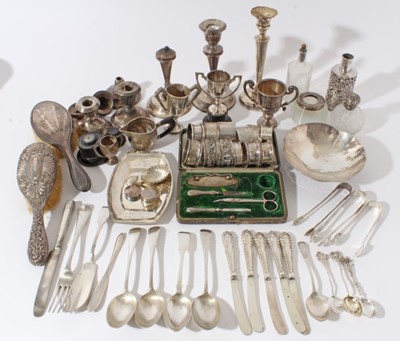 Lot 162 - Group of Georgian and later silver to include flatware, miniature trophies, candlesticks, silver mounted sauce bottle, napkin rings and other silver and white metal items, (various dates and makers)