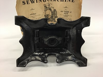 Lot 1879 - Miniature German  sewing machine and original instructions