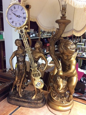 Lot 407 - Gilt putto table lamp with shade and a gilt figural clock