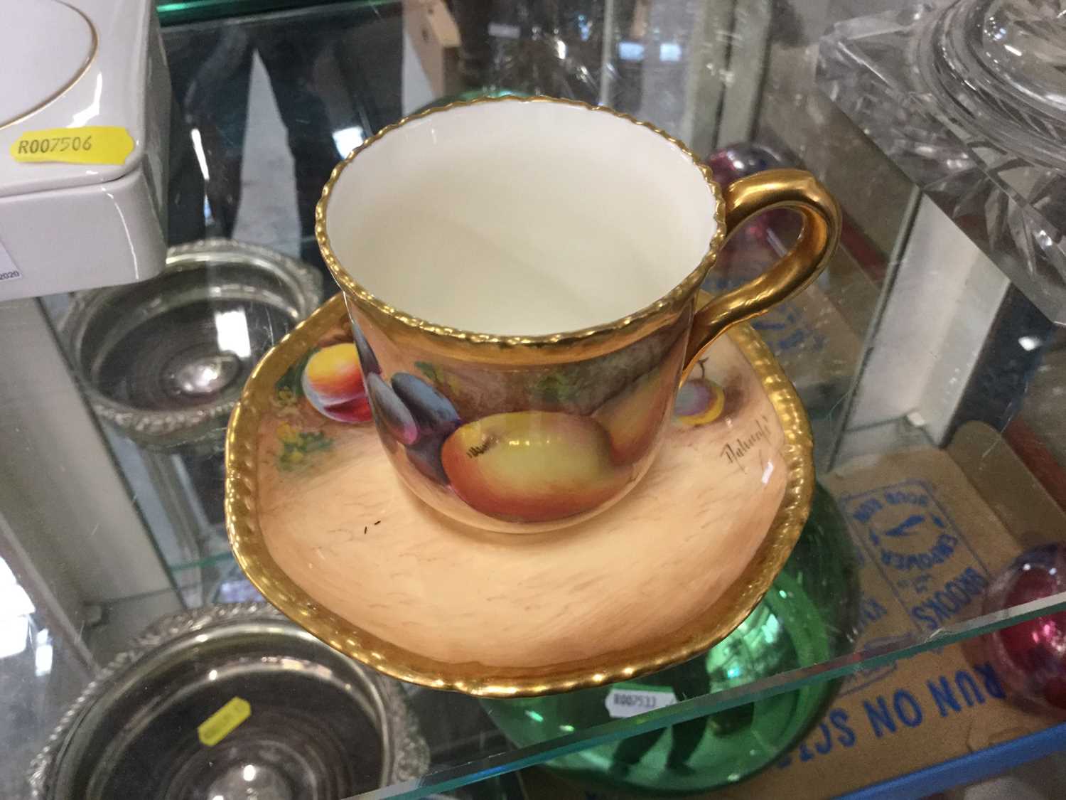 Lot 47 - Royal Worcester cabinet cup and saucer hand painted with fruit