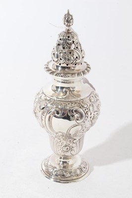 Lot 45 - Good quality George V silver sugar castor with ornate embossed foliate and fruit decoration, raised on circular foor (London 1911), maker Goldsmiths & Silversmiths Co, 8oz, 20.5cm in height