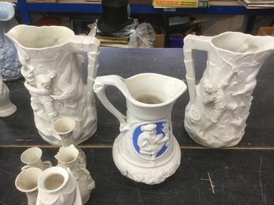 Lot 173 - Collection of Victorian Parian ware jugs, including signed example by W E Cobridge, and others, approximately 13