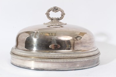Lot 234 - 19th century silver plated serving dome of conventional form with gadrooned and reeded borders, engraved armorial and central acanthus leaf and scroll handle, 45.5cm in overall length
