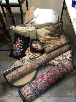 Lot 487 - Various textiles, including two rugs, cushions, footstools, and a box of linens and tablecloths