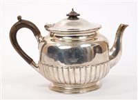 Lot 455 - Victorian silver teapot of half-fluted...