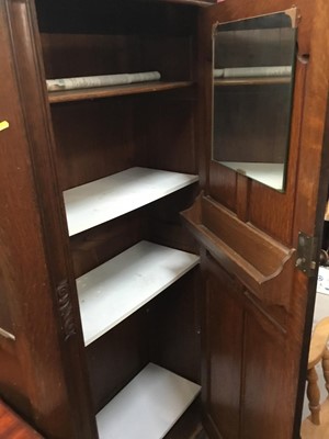 Lot 971 - 1950s oak hall wardrobe with linen fold decoration