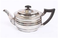 Lot 460 - George V silver teapot of oval ribbed form,...