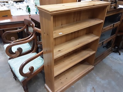 Lot 990 - Pine open bookcase and a contemporary oak cupboard