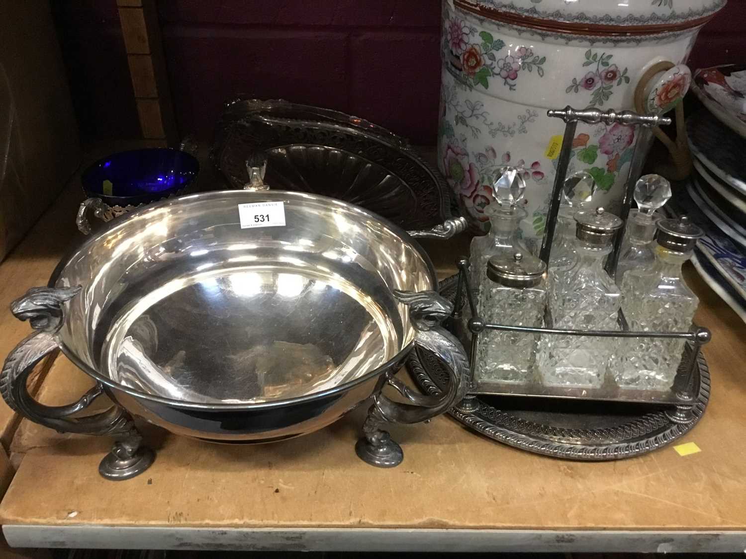 Lot 531 - Silver plated bowl by Garrards with three scrolled supports.