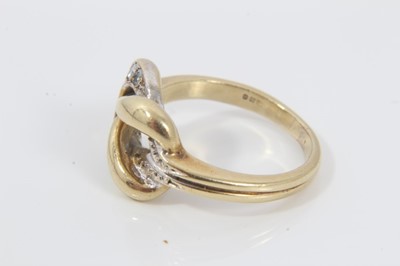 Lot 64 - 18ct gold and diamond knot ring