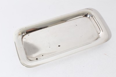 Lot 68 - George V silver serving tray of rectangular form with rounded corners and presentation inscription to underside, (Birmingham 1923), maker Hukin & Heath, 13oz, 29.5cm in length