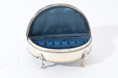 Lot 19 - George V Silver ring / jewellery box of crescent form with hinged lid, opening to reveal fitted silk and velvet lined interior, raised on four feet, (Birmingham 1919) 14.2cm in length
