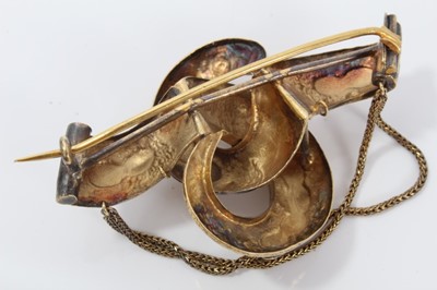 Lot 139 - Victorian gold scroll knot brooch with semi-precious pink stones in original fitted box